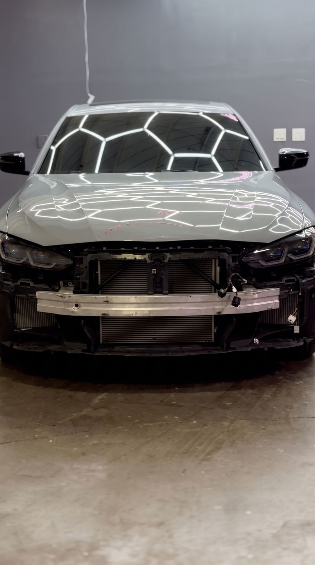 BMW with front-end collision damage, before repair