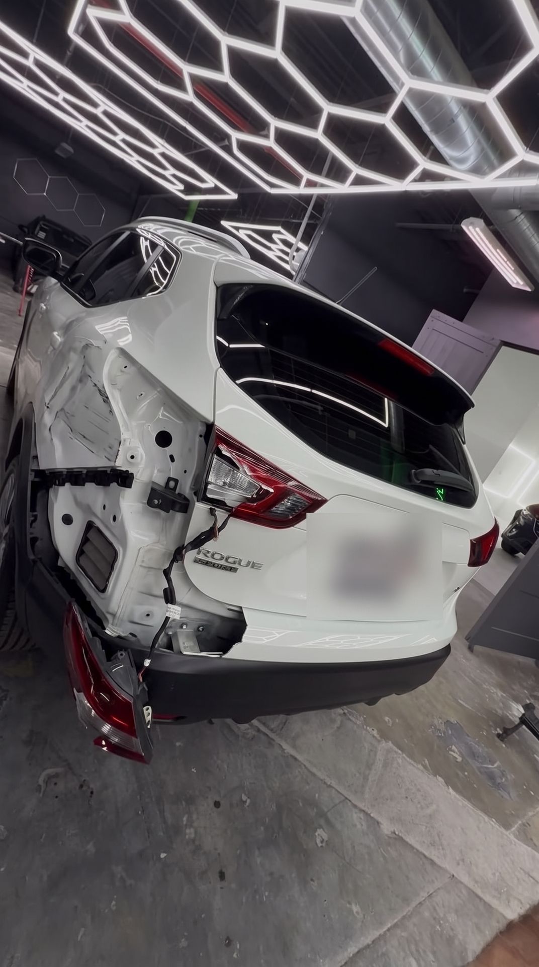 Nissan Rogue with crushed rear quarter, before repair